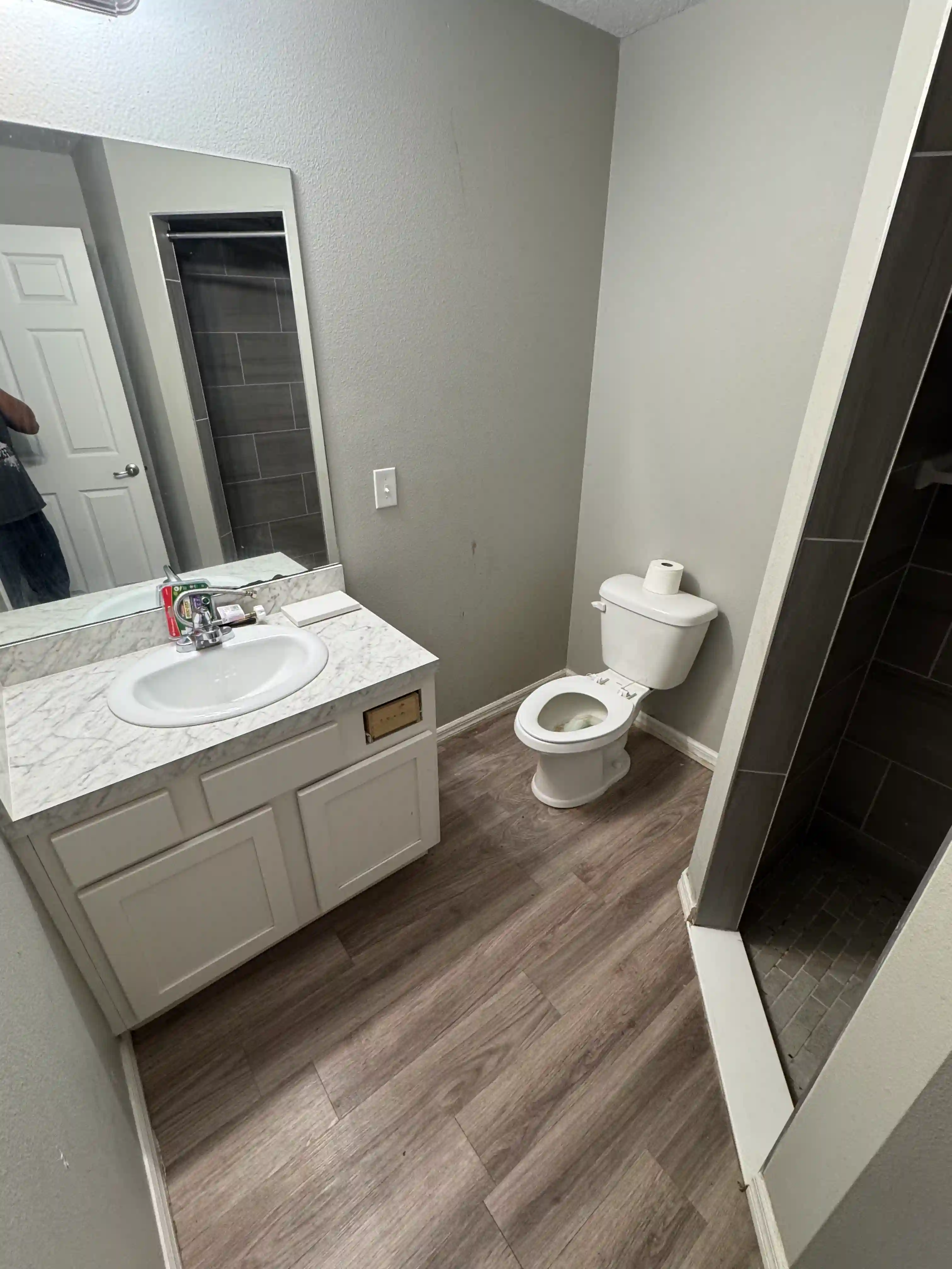 Bathroom vanity toilet shower vacant unit