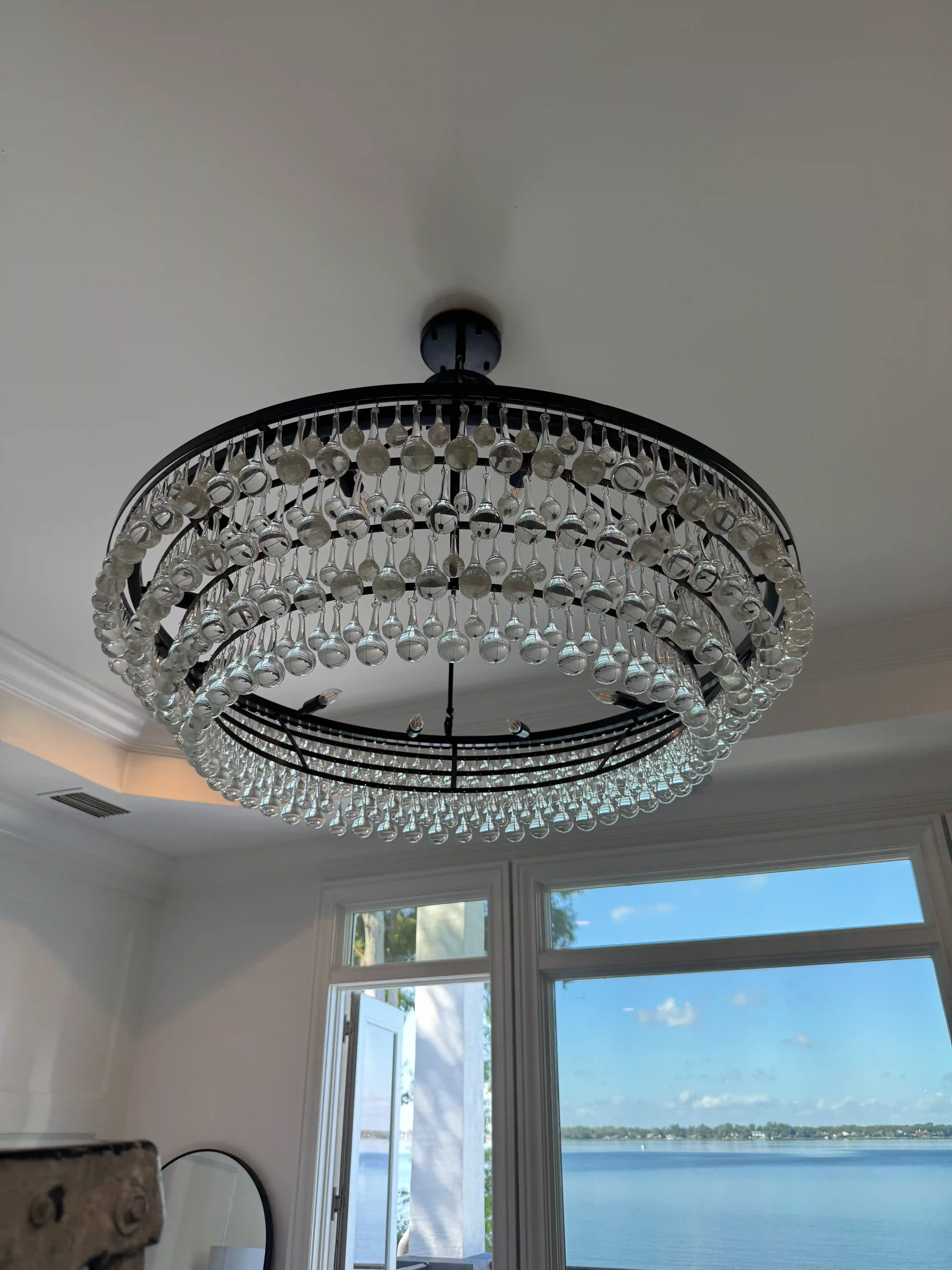 Bedroom crystal chandelier lake view