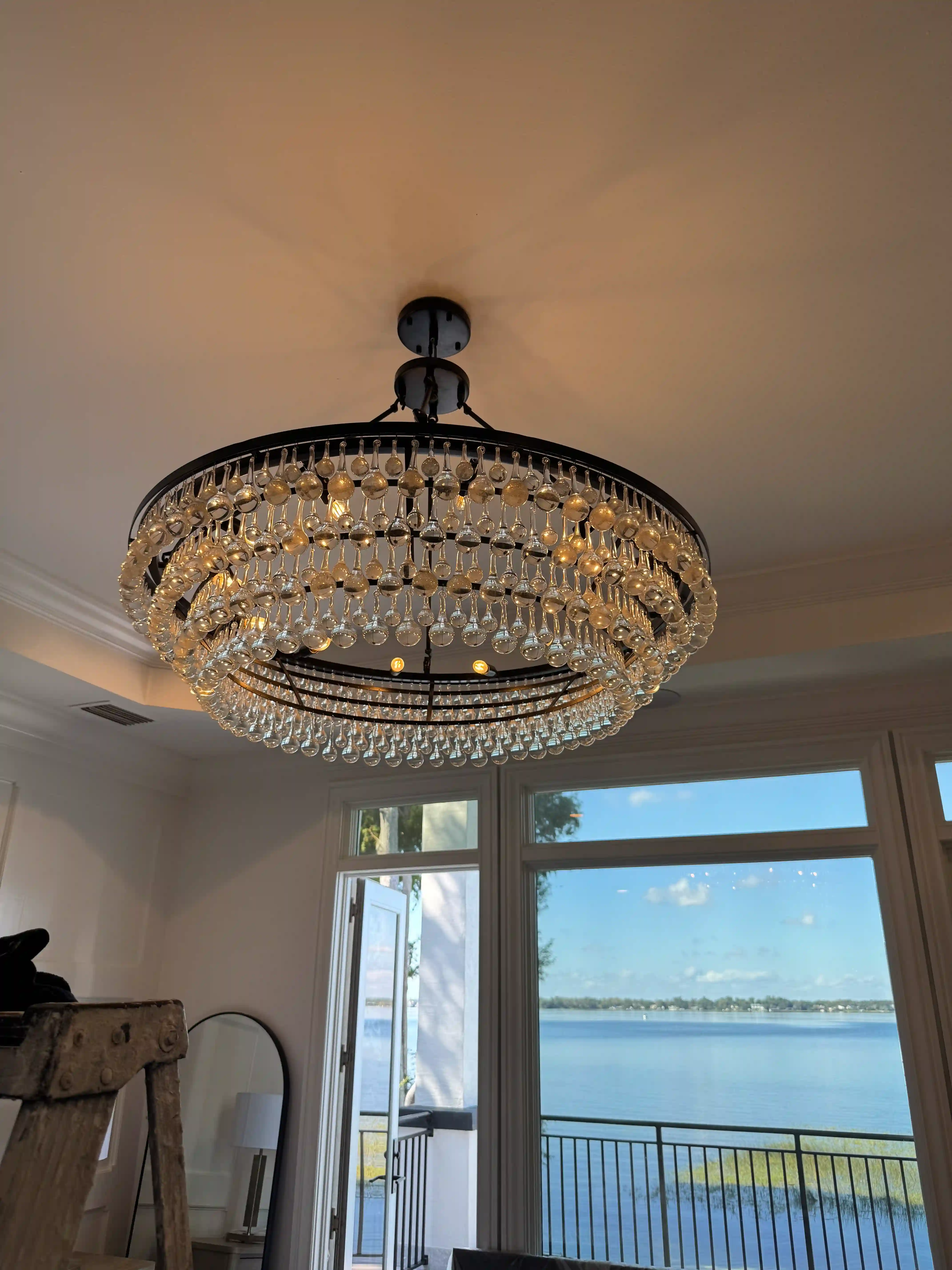 Bedroom crystal chandelier lake view