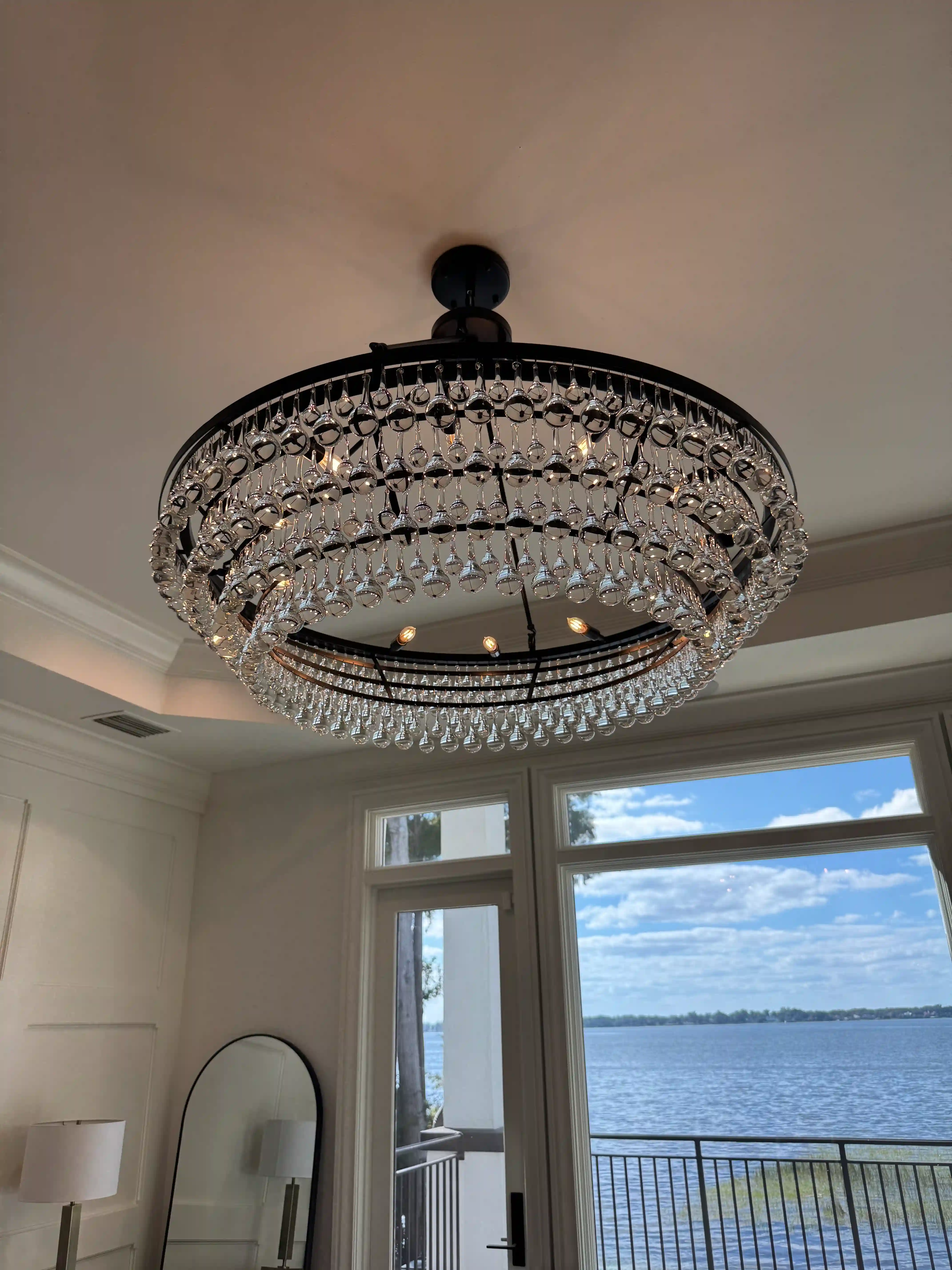 Bedroom crystal chandelier lake view