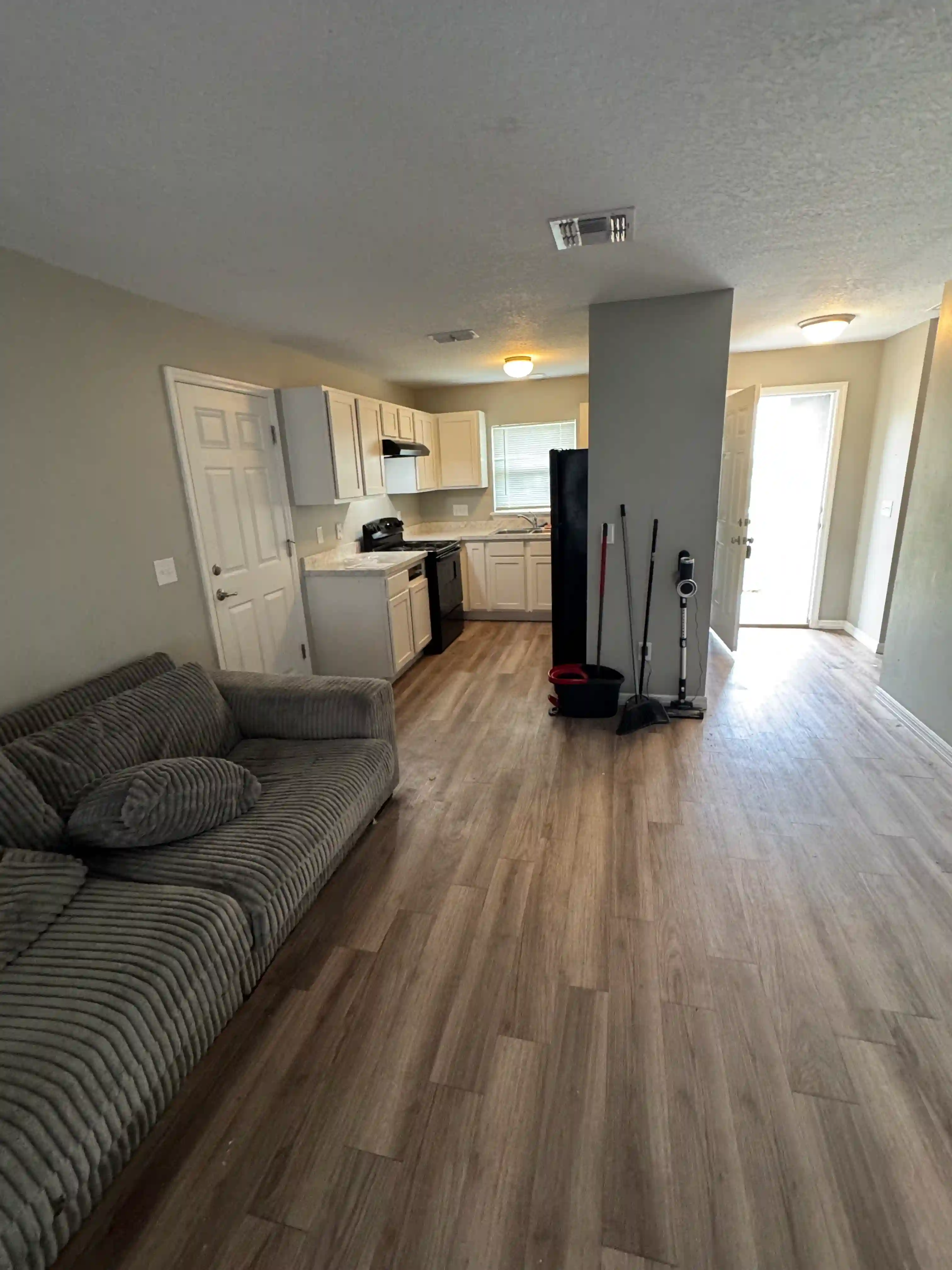Living room kitchen cleaning supplies vacant unit
