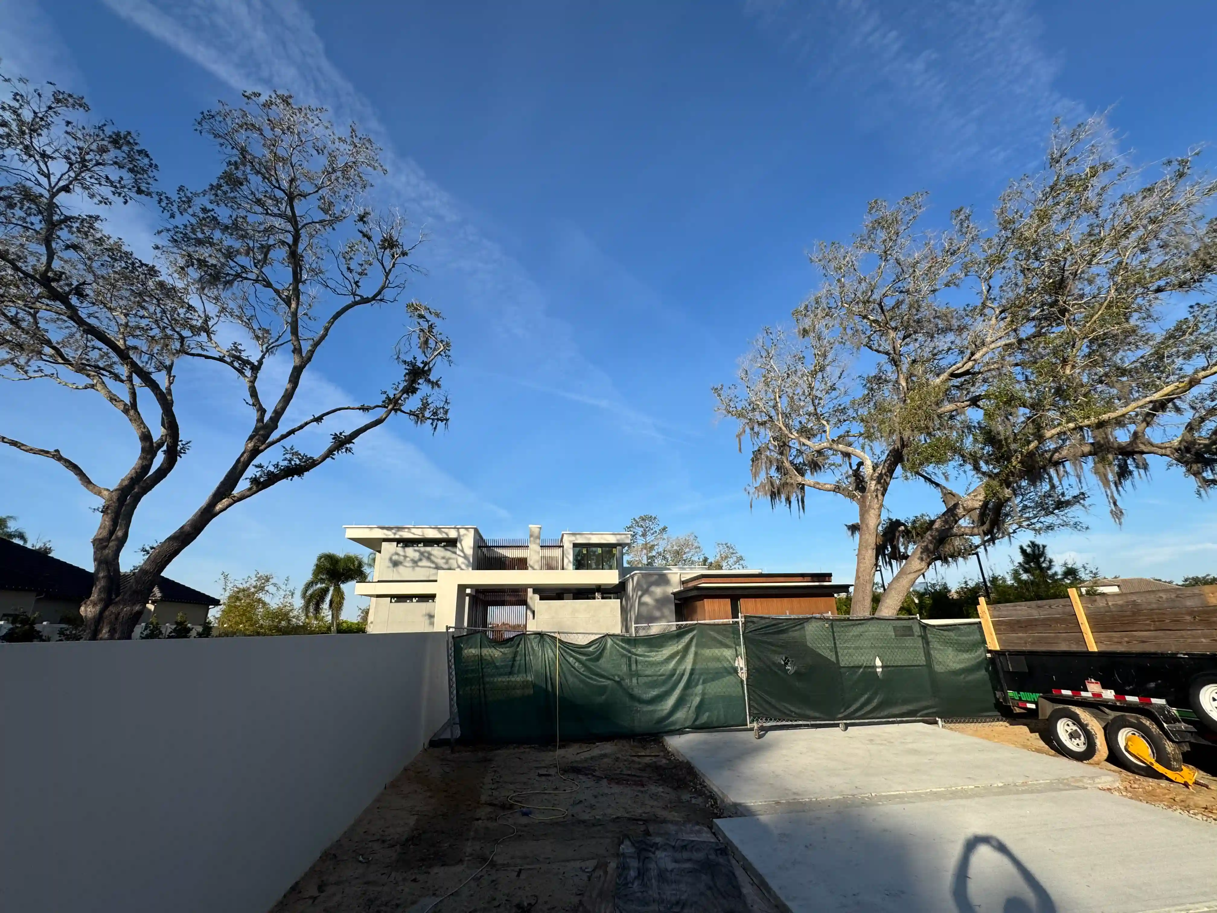 Modern home side yard construction fence
