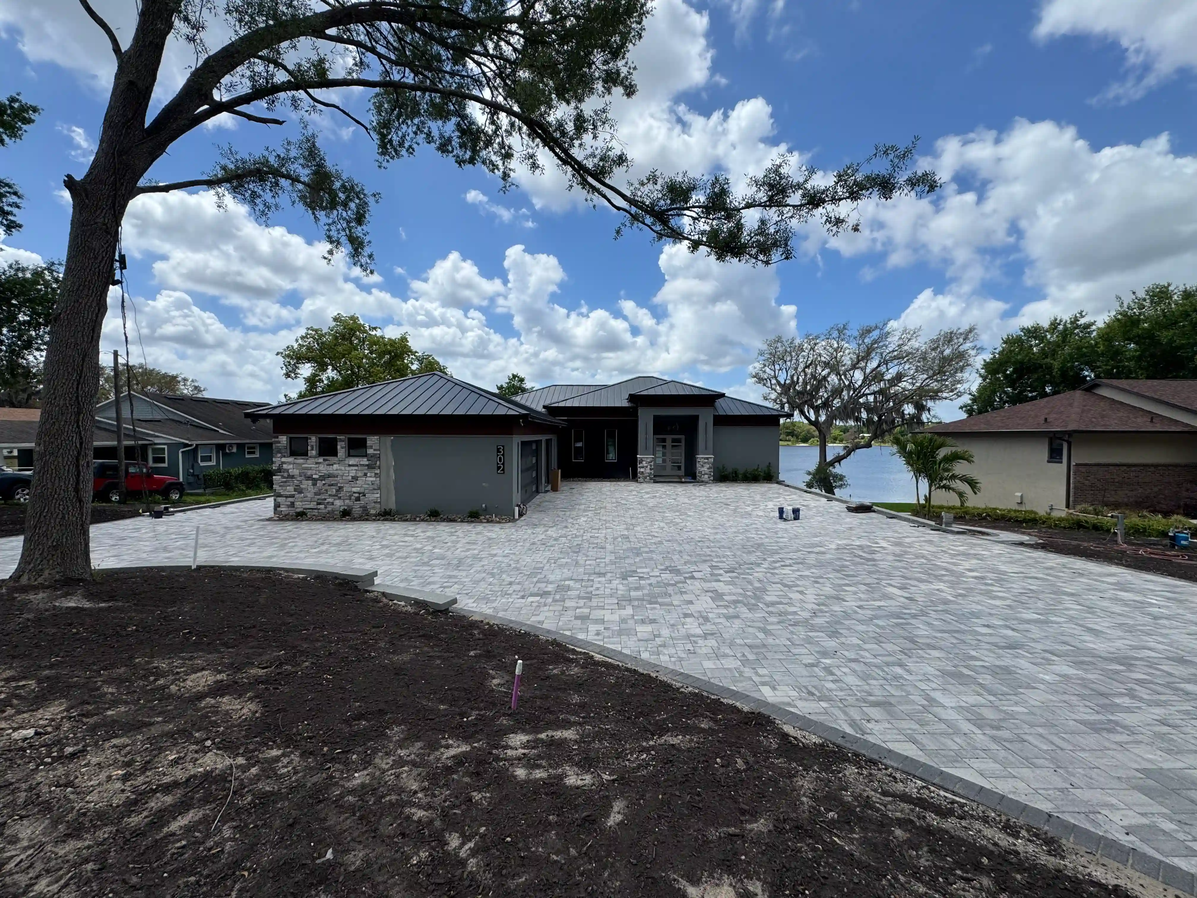 Modern lakefront home exterior driveway