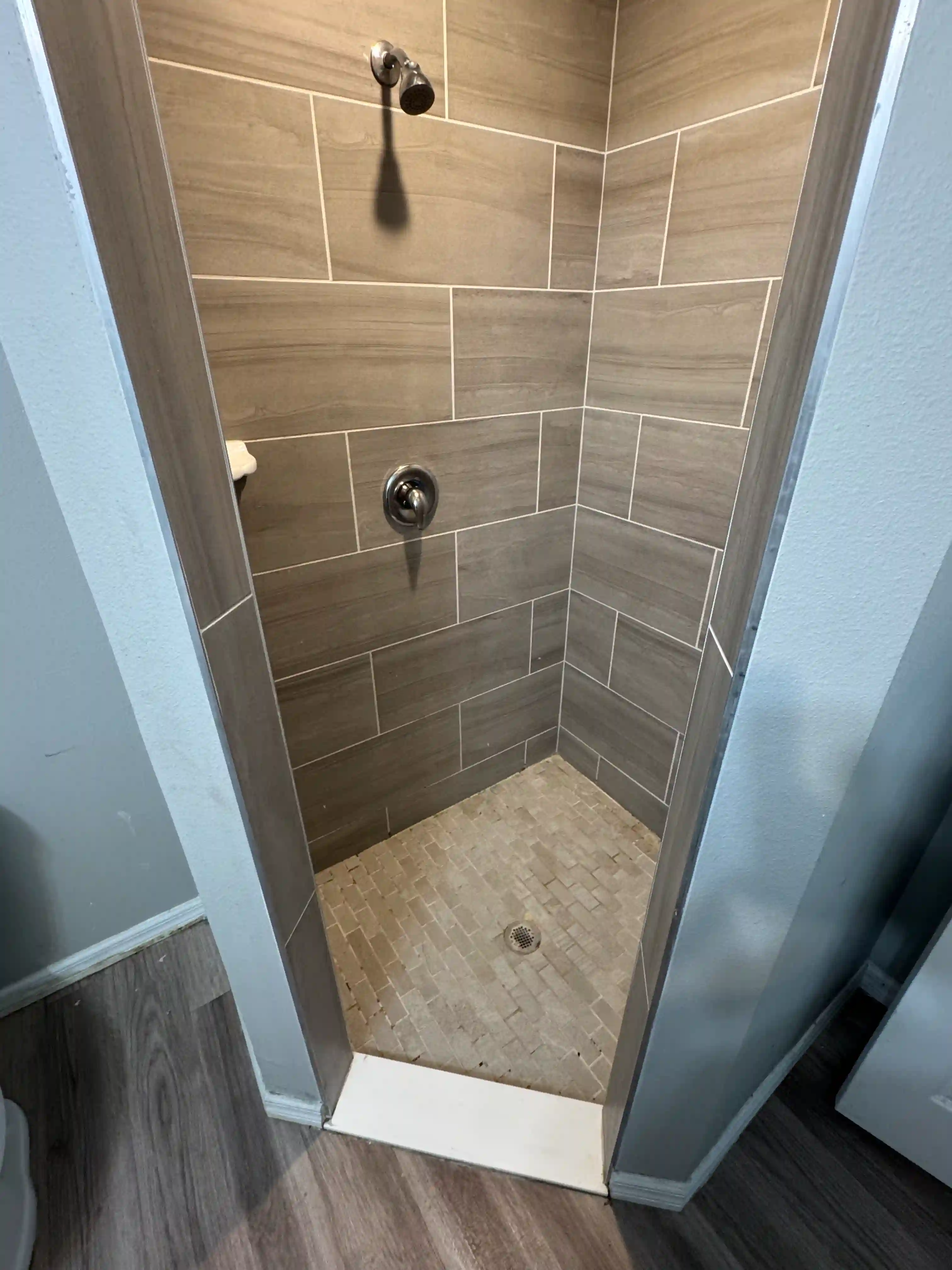 Shower tan tile stall vacant unit
